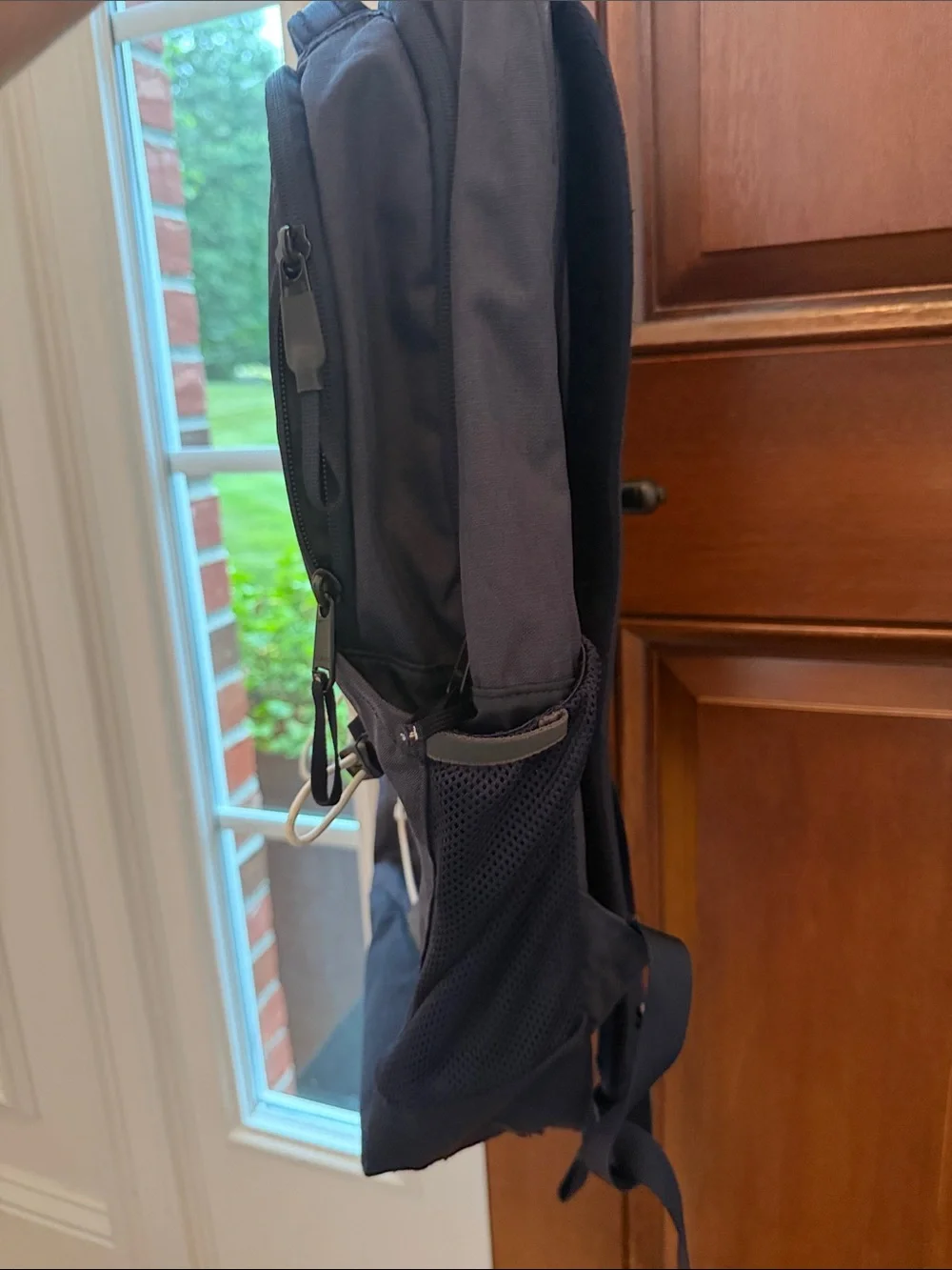 The North Face Navy Blue Backpack with White Bungee Cord